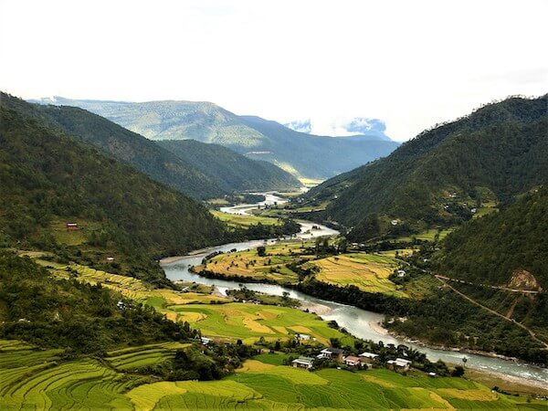A valley of Bhutan shown from the top angle by VisitBhutan.com